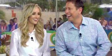 Tim Daggett with his wife in a show