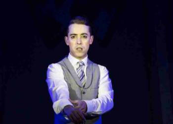 Marc Pickering performing on stage