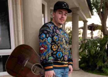 Pedro Tovar with guitar in his hand