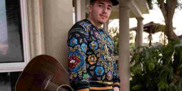 Pedro Tovar with guitar in his hand