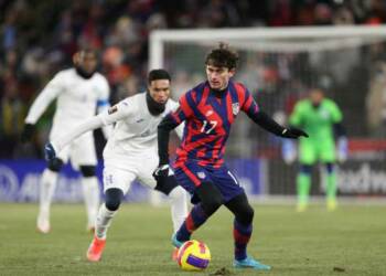 Luca de la Torre playing in the field