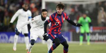 Luca de la Torre playing in the field