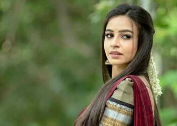 Divya Ganesh in red saree