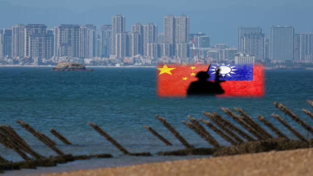 Anti-landing barricades are pictured on an a beach on Kinmen, Taiwan, on Feb. 21. The Chinese city of Xiamen is seen in the background. © Reuters