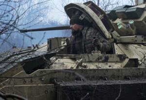 A Ukrainian serviceman prepares for combat close to Avdiivka, in the Donetsk region.
