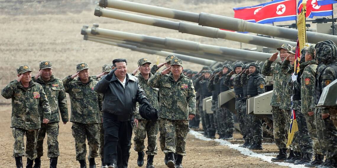 North Korean leader Kim Jong Un (C) saluting personnel during a training competition between the combined forces of the Korean People's Army tank crews at an undisclosed location in North Korea. © STR / KCNA VIA KNS / AFP