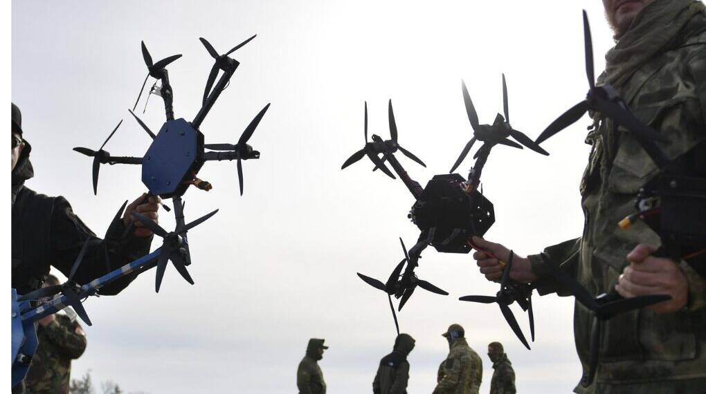 A Ukrainian FPV combat drone in flight, equipped with an explosive payload—part of the country's game-changing drone warfare strategy reshaping modern military tactics.