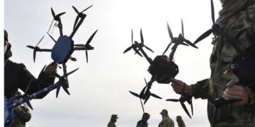 A Ukrainian FPV combat drone in flight, equipped with an explosive payload—part of the country's game-changing drone warfare strategy reshaping modern military tactics.