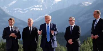 French President Emmanuel Macron, from left, Canada's Prime Minister Mark Carney, U.S. President Donald Trump, Britain's Prime Minister Keir Starmer, and German Chancellor Friedrich Merz prepare for a family photo during the G7 Summit, in Kananaskis, Alberta, Monday, June 16, 2025. (Suzanne Plunkett/Pool Photo via AP)