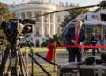US President Donald Trump cuts a red ribbon outside the White House as television cameras and microphones sit unused, with Marine One in the background, symbolising a media blackout.