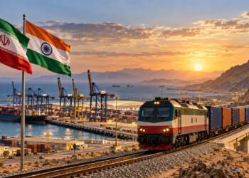 Freight train carrying containers travels from Chabahar port through rugged Iranian mountains, symbolising India’s emerging rail link to Iran and Central Asia.” Chabahar-Zahedan railway