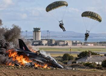 RAF Hawk T2 training jet crashes and burns near RAF Valley on Anglesey as two pilots parachute to safety.”
