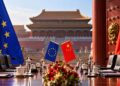 EU-China trade talks represented by European Union and Chinese flags at a diplomatic meeting in Beijing.