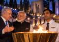 Benjamin Netanyahu with Narendra Modi and an Indian pilot at a ceremonial flame for the Israel Independence Day torch.